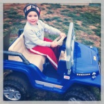 Little man driving his Jeep.